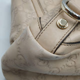 Close-up of Gucci bags hardware and fine stitching