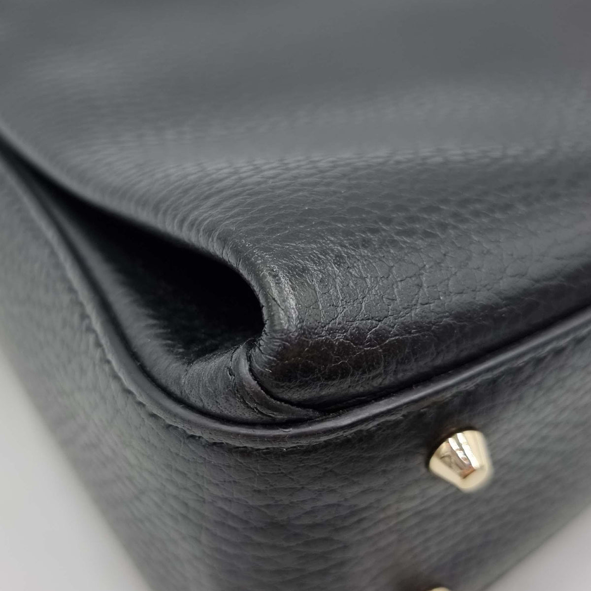 Close-up of Interlocking bags hardware and fine stitching