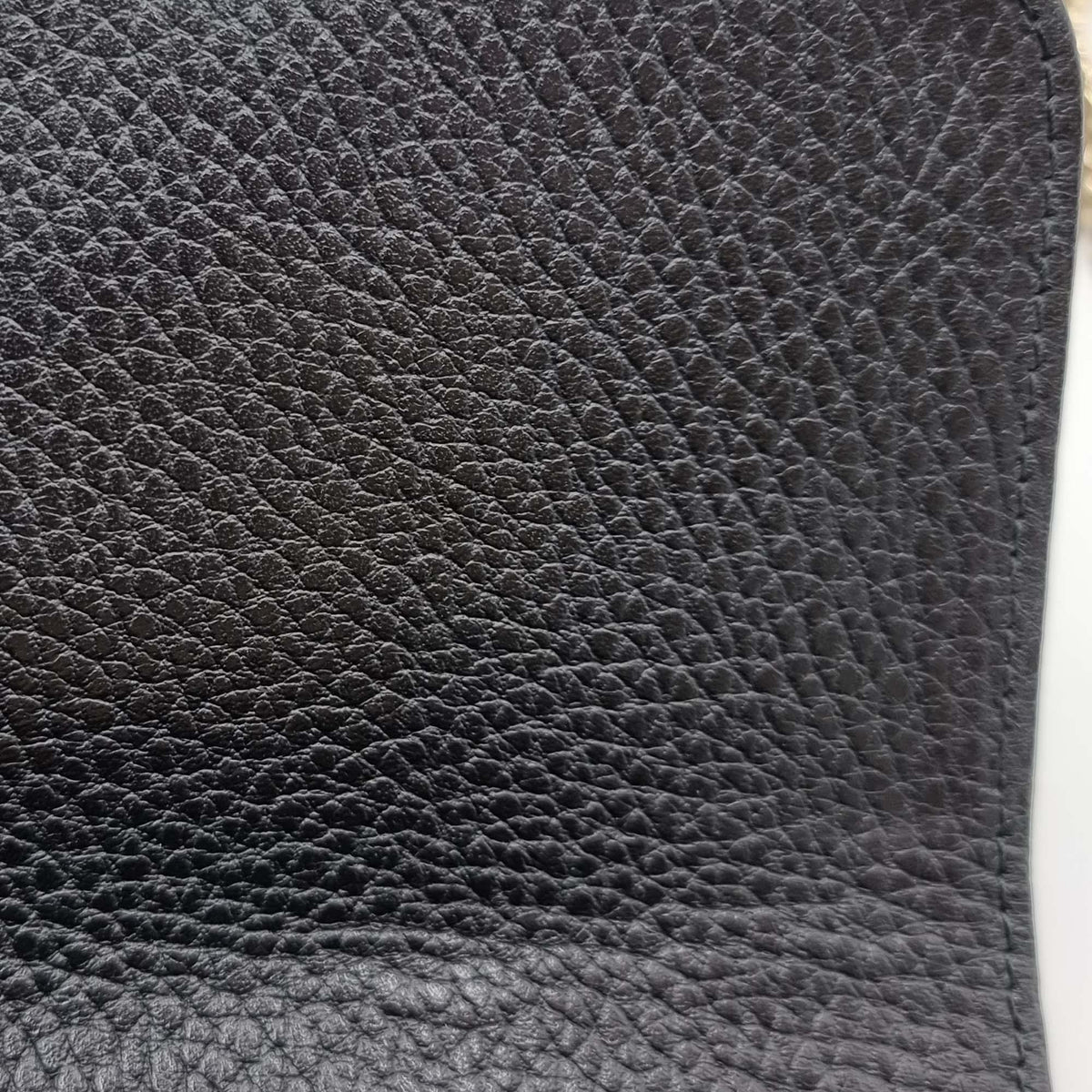 Close-up of Interlocking bags hardware and fine stitching