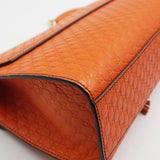 Close-up of Gucci bags hardware and fine stitching