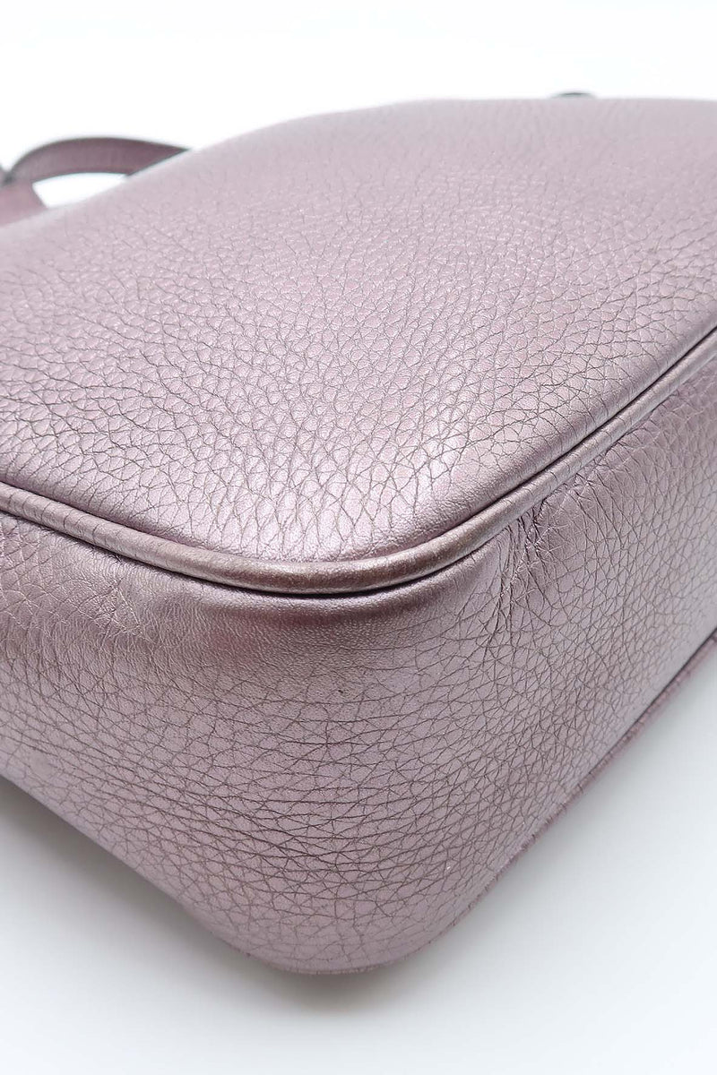 Close-up of Metallic bags hardware and fine stitching