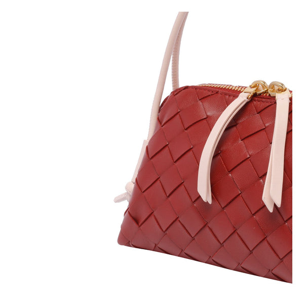 Close-up of Bottega Veneta clutches hardware and fine stitching