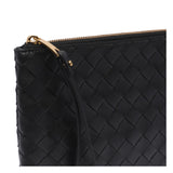 Close-up of Bottega Veneta clutches hardware and fine stitching