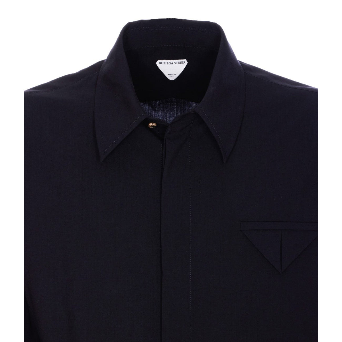 Close-up of Bottega Veneta blouses hardware and fine stitching