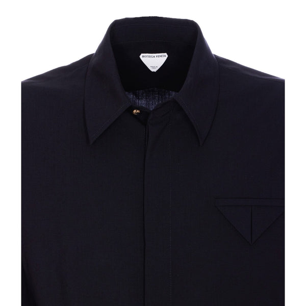 Close-up of Bottega Veneta blouses hardware and fine stitching