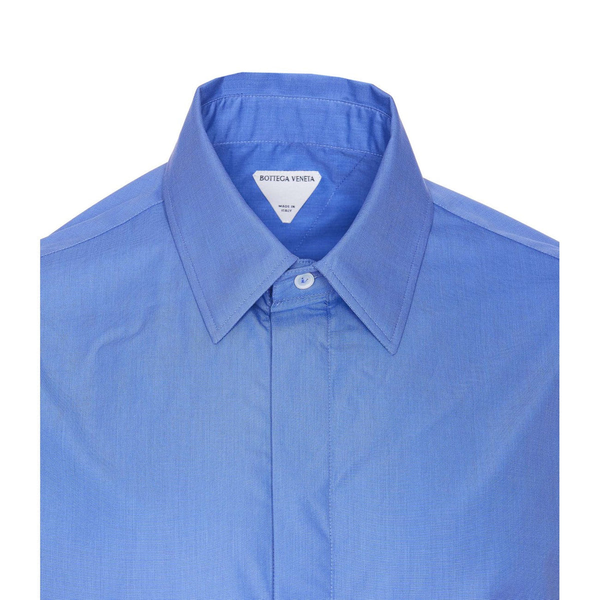 Close-up of Bottega Veneta blouses hardware and fine stitching