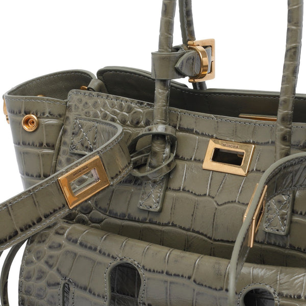Close-up of Balenciaga totes hardware and fine stitching