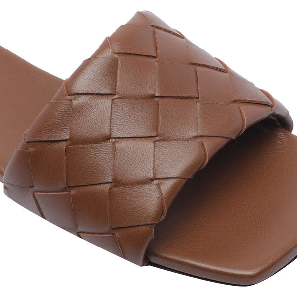 Close-up of Bottega Veneta sandals hardware and fine stitching