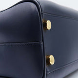 Close-up of Cassandre bags hardware and fine stitching
