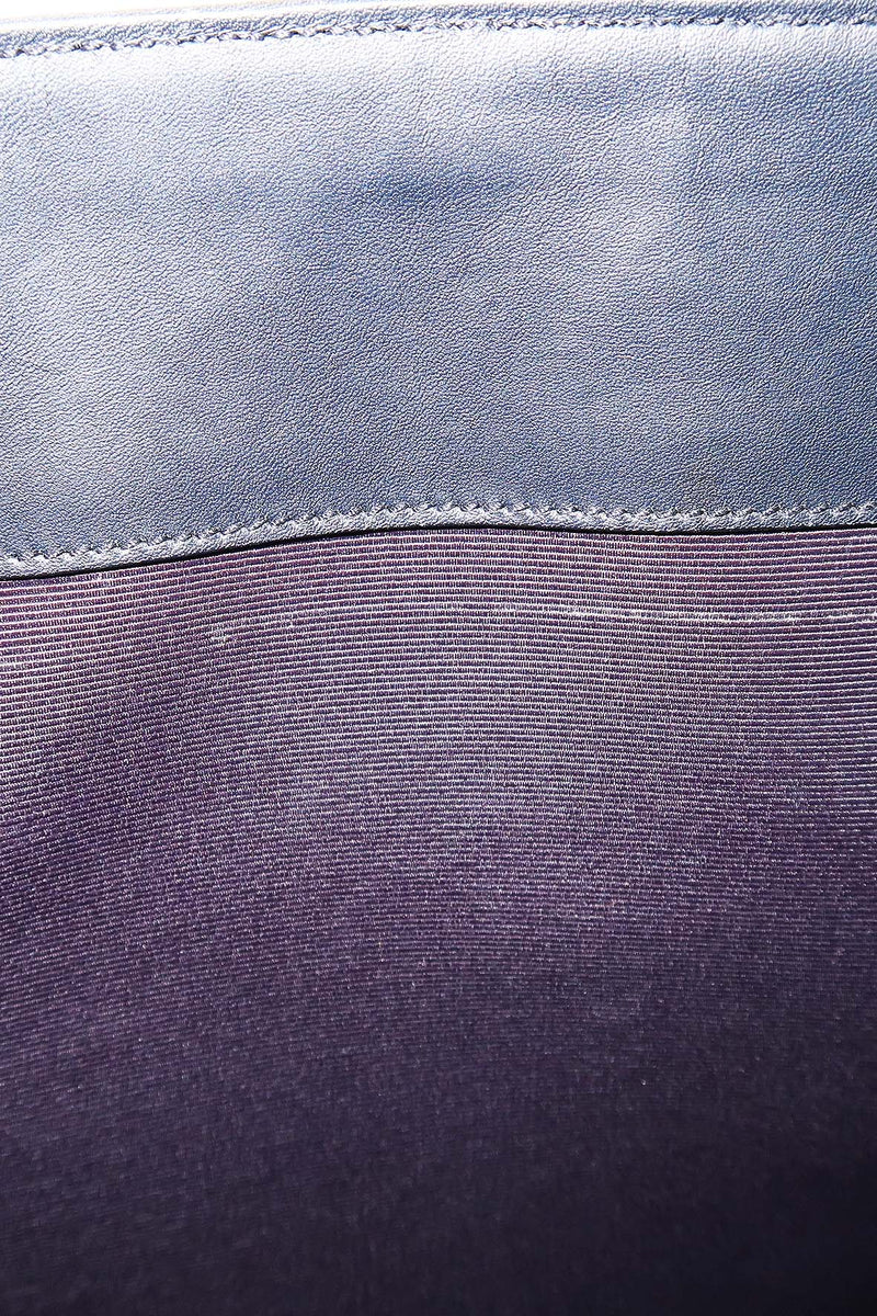 Close-up of Cassandre bags hardware and fine stitching