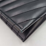Close-up of Envelope bags hardware and fine stitching