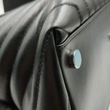 Close-up of Loulou bags hardware and fine stitching