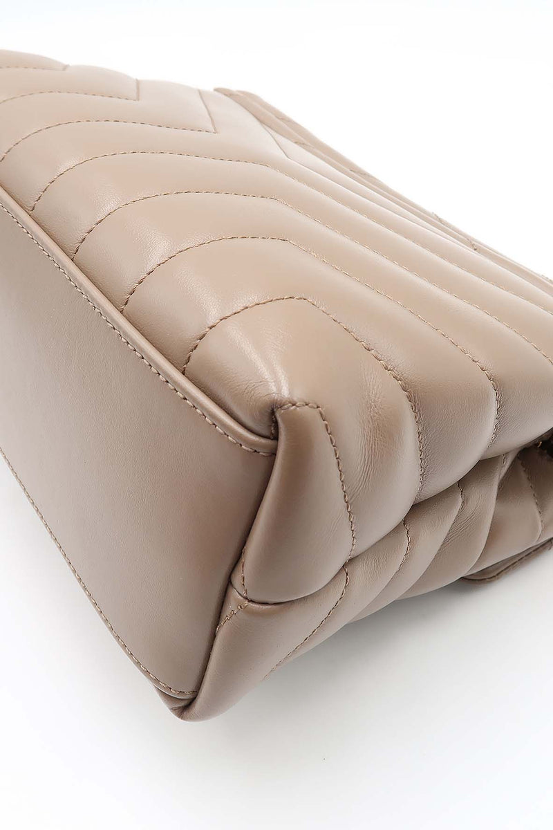 Close-up of Loulou bags hardware and fine stitching