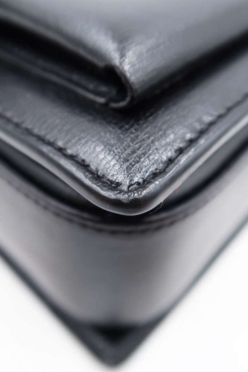 Close-up of Medium bags hardware and fine stitching