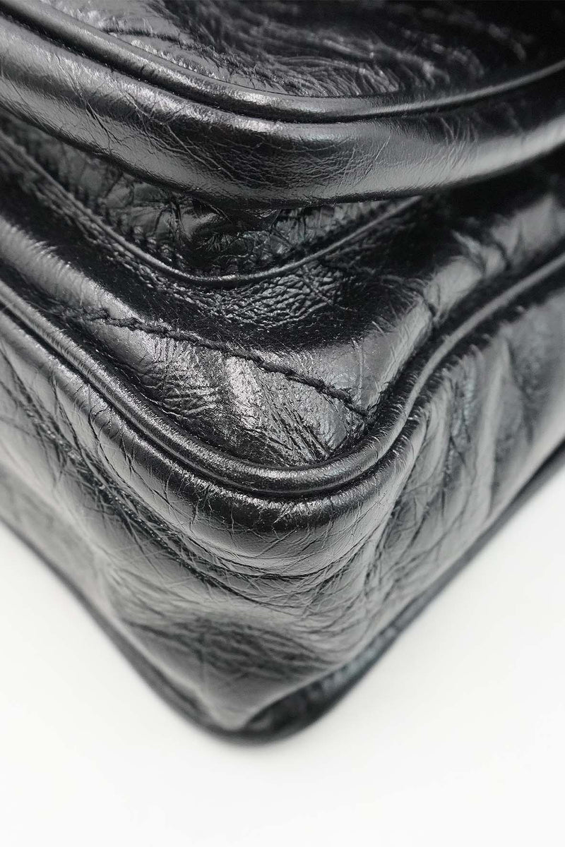 Close-up of Medium bags hardware and fine stitching