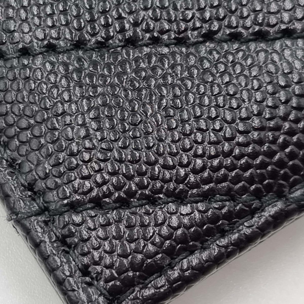 Monogram premium bags detail and craftsmanship close-up