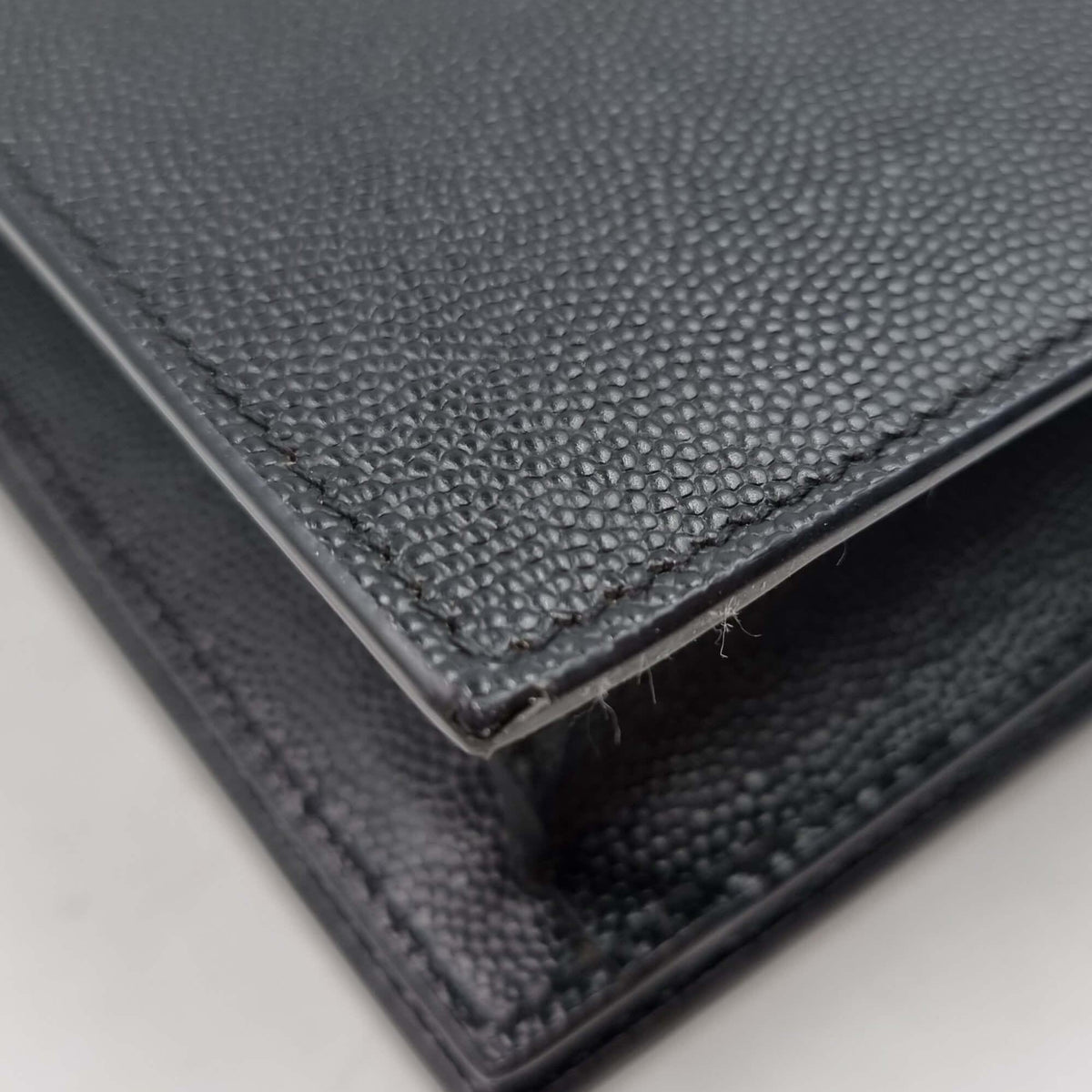 Close-up of Monogram bags hardware and fine stitching