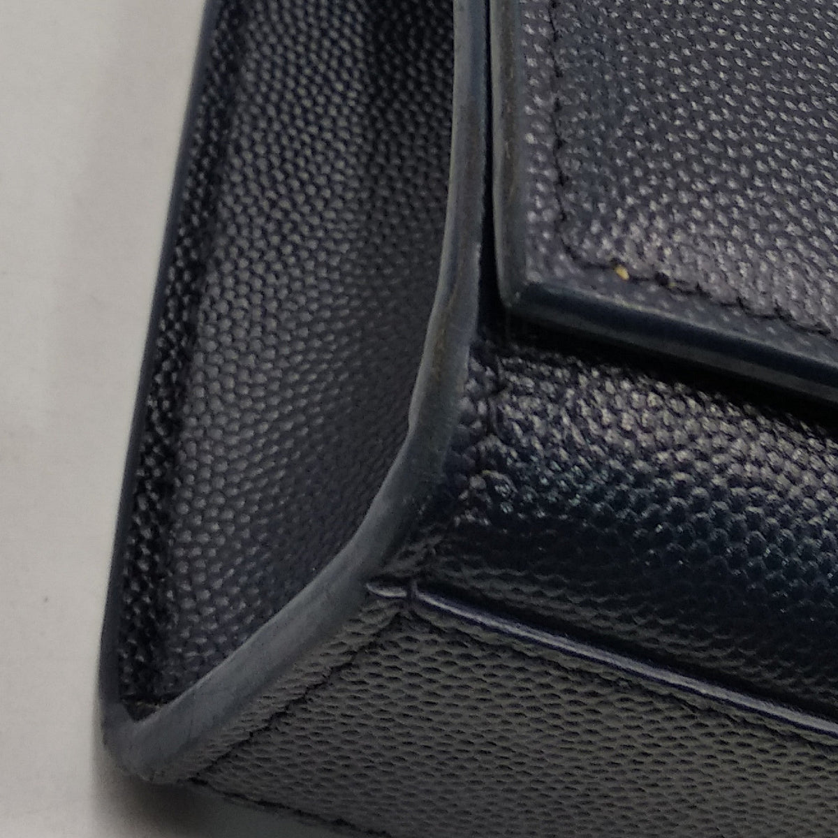 Monogram premium bags detail and craftsmanship close-up
