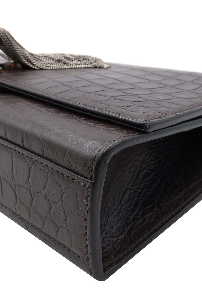 Close-up of Monogram bags hardware and fine stitching