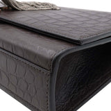 Close-up of Monogram bags hardware and fine stitching