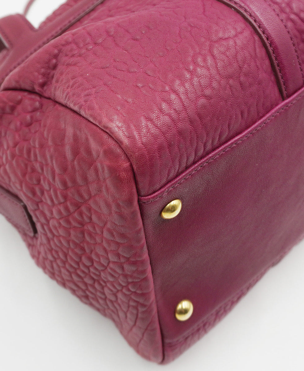 Close-up of Pebbled bags hardware and fine stitching