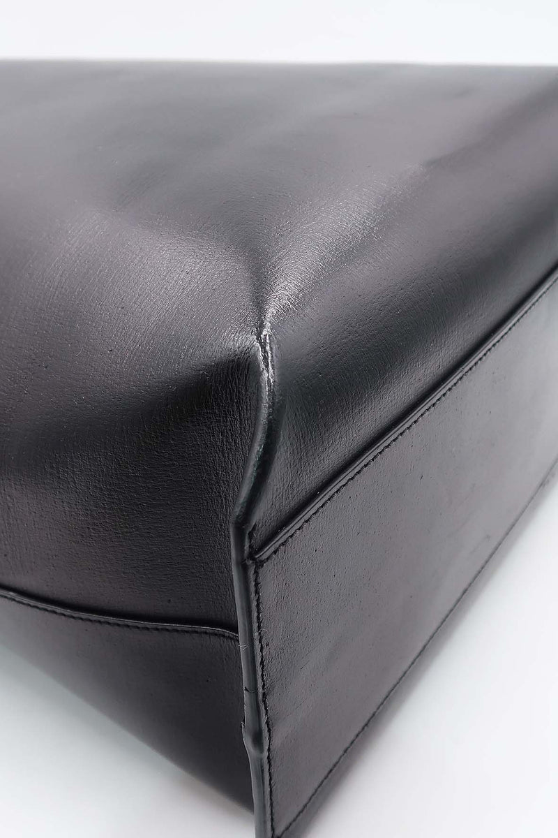 Close-up of Perforated bags hardware and fine stitching