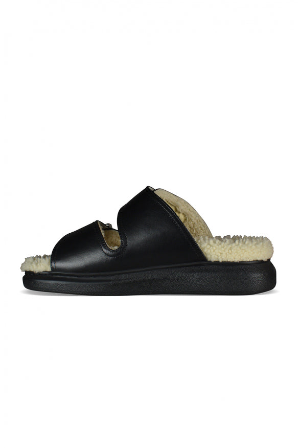 Close-up of Alexander McQueen sandals hardware and fine stitching