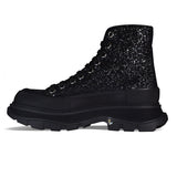 Close-up of Alexander McQueen athletic hardware and fine stitching