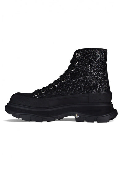 Close-up of Alexander McQueen athletic hardware and fine stitching
