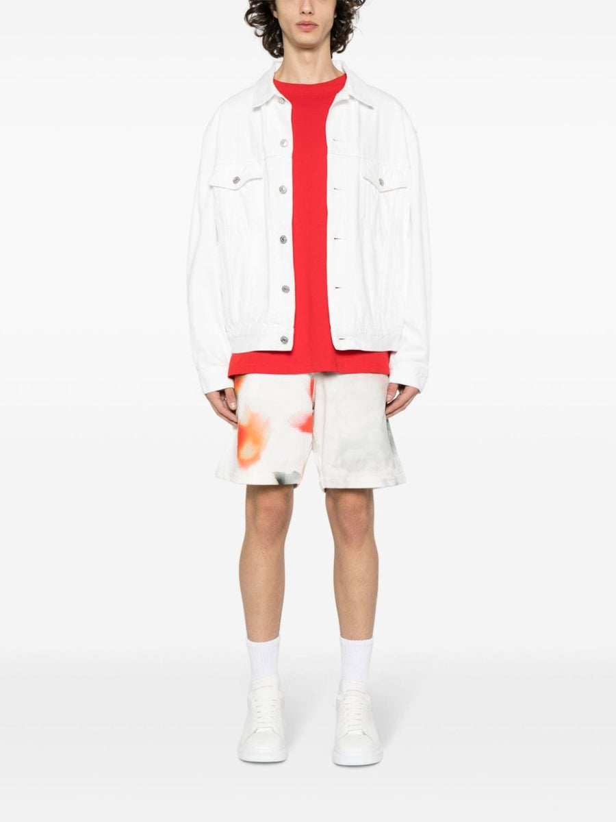 Close-up of Alexander McQueen pants hardware and fine stitching