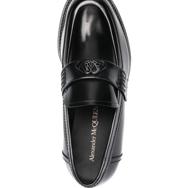 Close-up of Alexander McQueen slides hardware and fine stitching