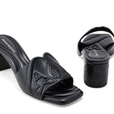 Close-up of Alexander McQueen sandals hardware and fine stitching