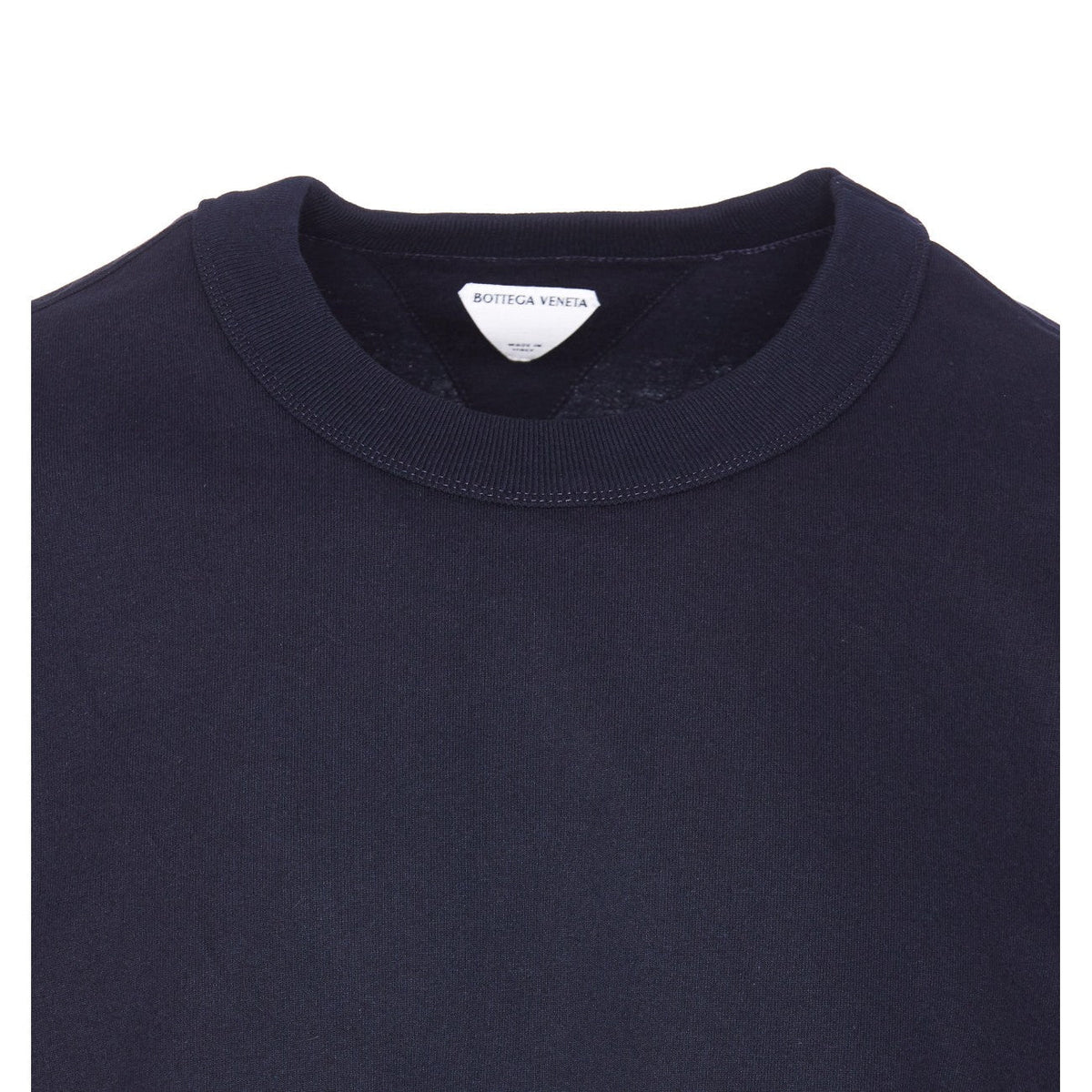 Close-up of Bottega Veneta tee shirts hardware and fine stitching