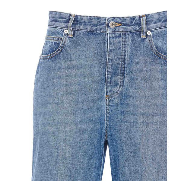 Close-up of Bottega Veneta pants hardware and fine stitching