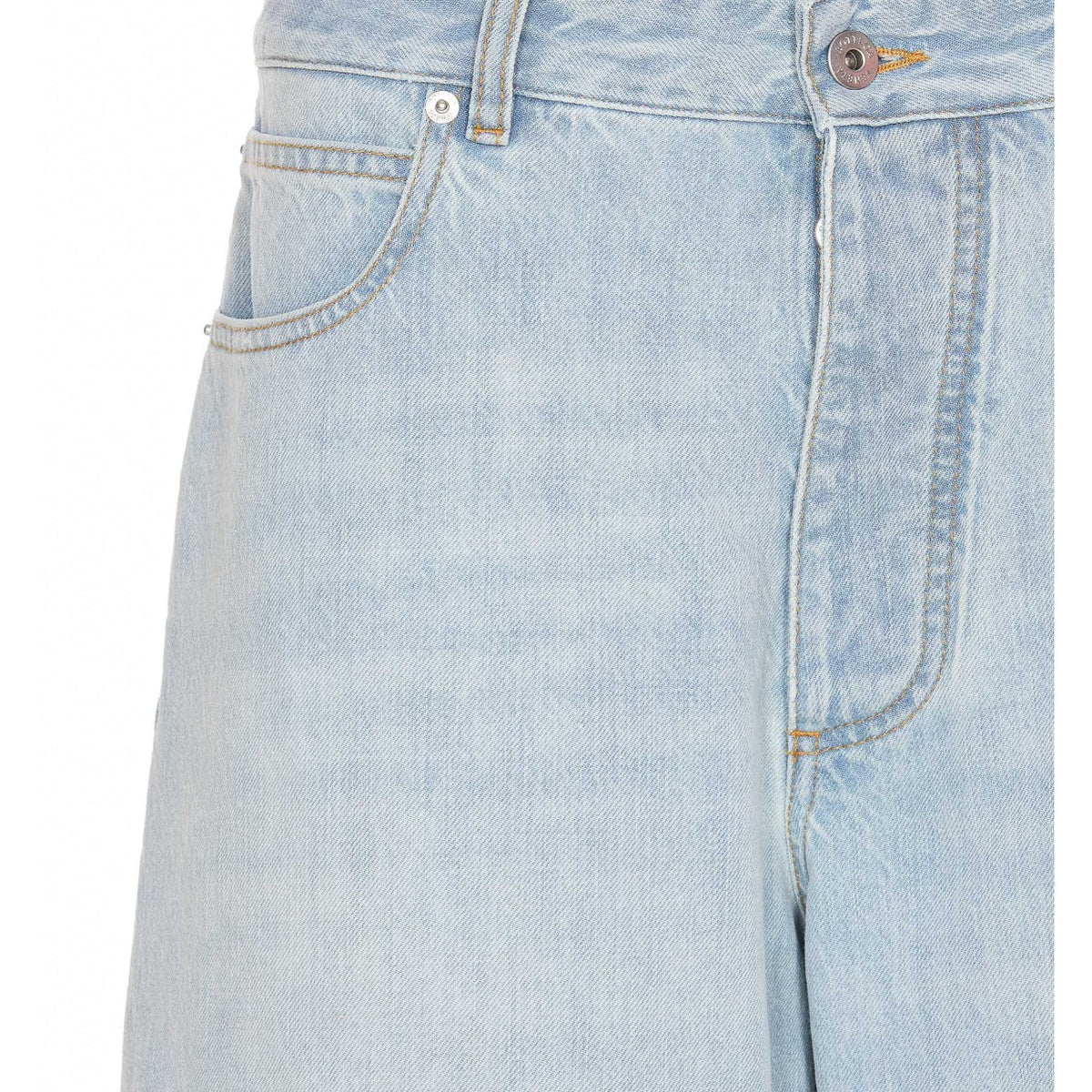 Close-up of Bottega Veneta pants hardware and fine stitching