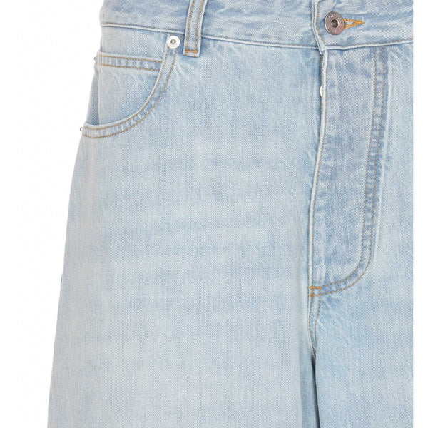 Close-up of Bottega Veneta pants hardware and fine stitching